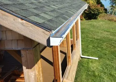 Seamless gutter with leaf guard on a lakeside pavilion in Addison County VT